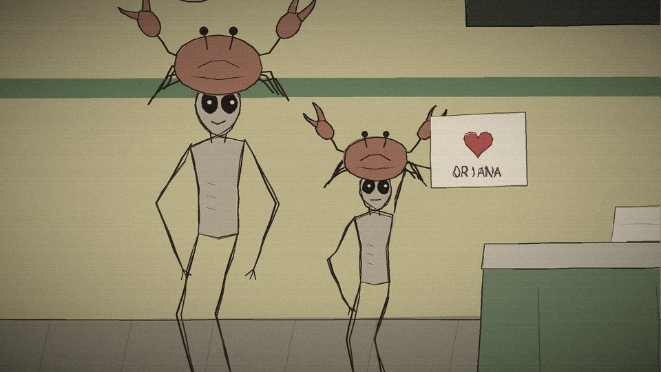 The Crab Child holding up a hand-drawn card with a heart and ORIANA on it
